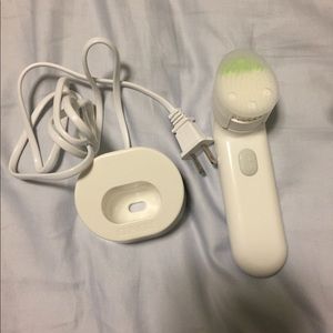 Brand new Clinique face brush with charger